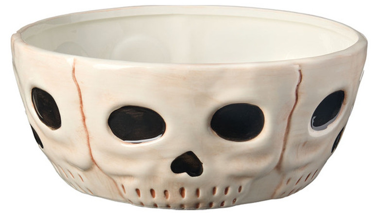 White serving bowl with a black and rust-colored skull design.
