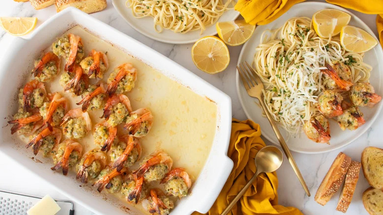 Baked Stuffed Shrimp Scampi served with lemons