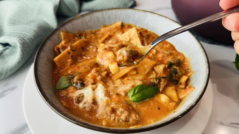 Super Creamy One-Pot Lasagna Soup in a bowl with a spoon