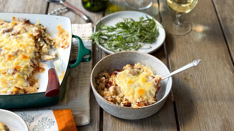 A baking dish and bowl full of French Onion Chicken And Rice Casserole