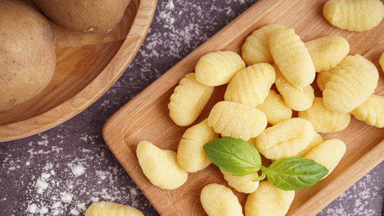 wooden board with freshly made gnocchi