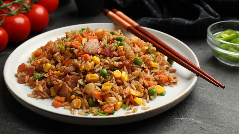 Plate of vegetable fried rice with chopsticks