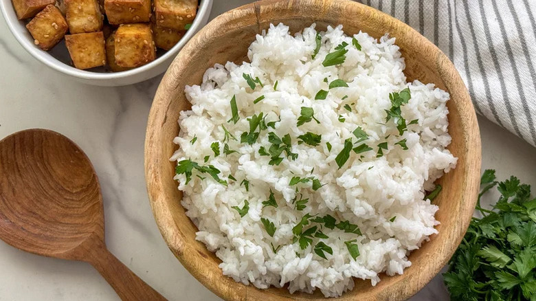 White rice in a bowl with herbs