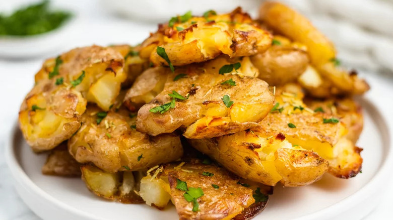 Crispy smashed potatoes on a plate
