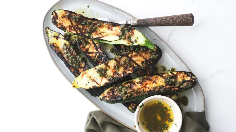 Grilled zucchini with a side of sauce