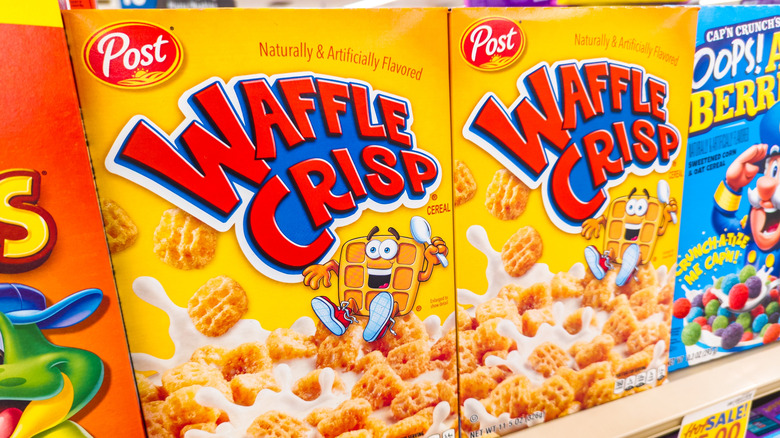Boxes of Waffle Crisp cereal on a grocery store shelf