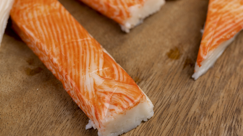 Imitation crab seen close-up on a wooden surface