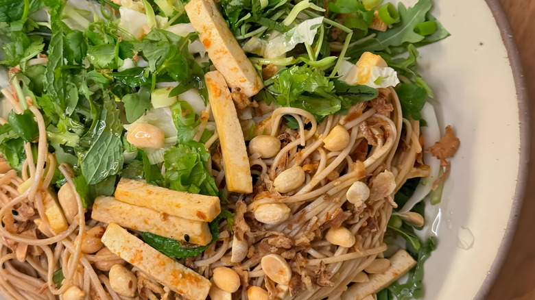 Soba noodle salad with tofu, peanuts, and greens