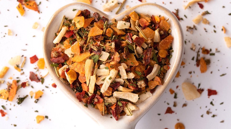 Close-up of Italian seasoning in a small, white, heart-shaped dish