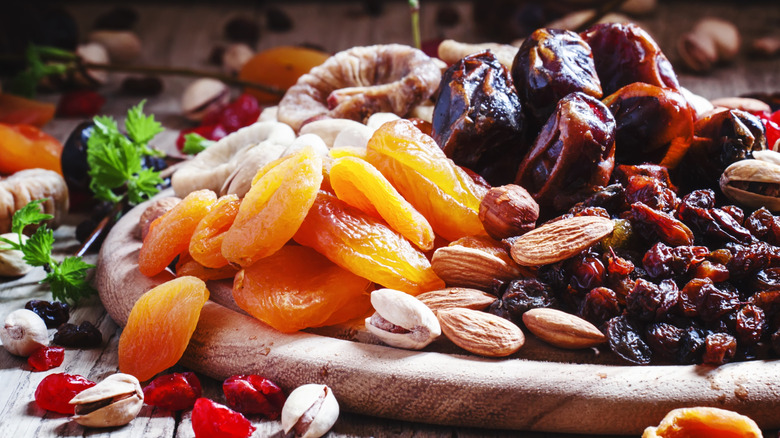 fruits and nuts on a board
