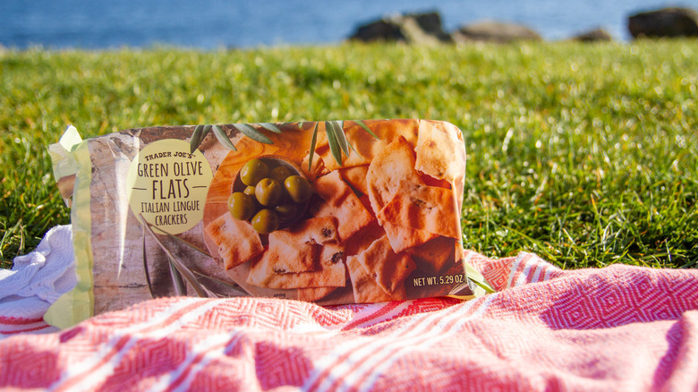 Green Olive Flats on a blanket in the grass