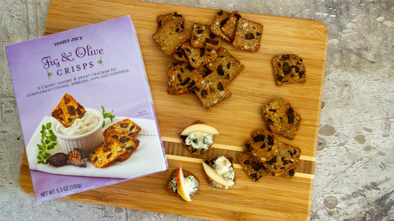 Fig & Olive Crisps on a board with toppings