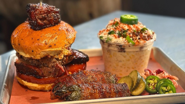 A barbecue sandwich with sides at Panther City BBQ