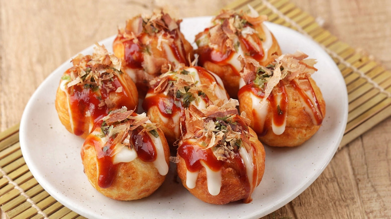 A plate of takoyaki on a table