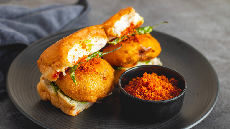 Two vada pav on a plate