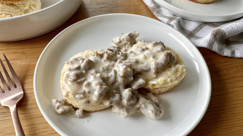 A plate of Buttermilk Biscuits And Sausage Cream Gravy