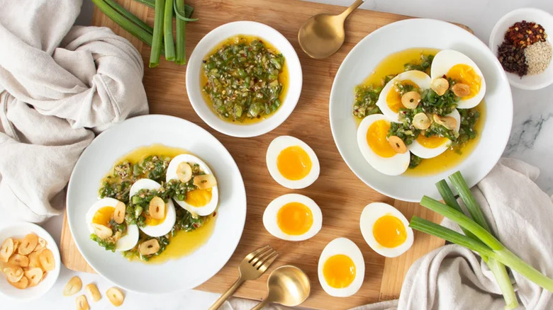 Jammy eggs with scallion drizzle and crispy garlic