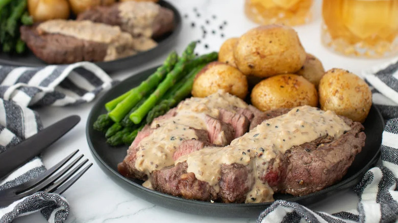 Steak with whiskey cream sauce