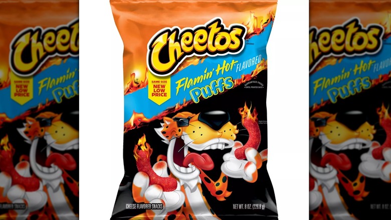 8-ounce bag of Cheetos Flamin' Hot puffs with Chester Cheetah mascot on a white background.