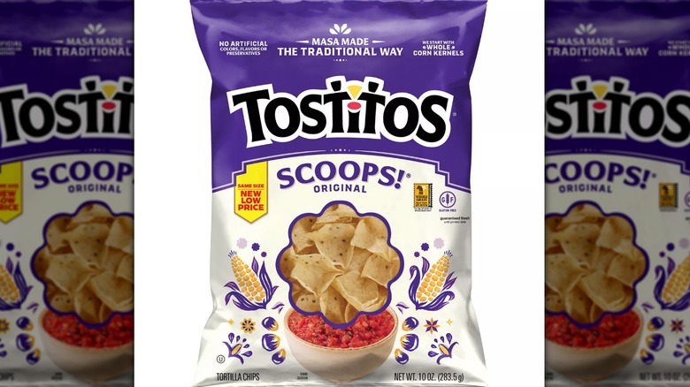 Purple and white 10-ounce bag of Tostitos scoops chips on a white background.