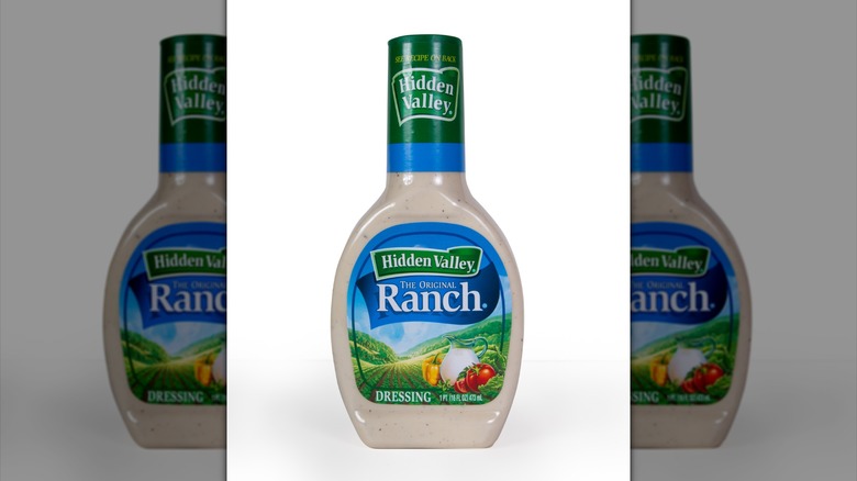 1 pint bottle of Hidden Valley ranch dressing on a white background.