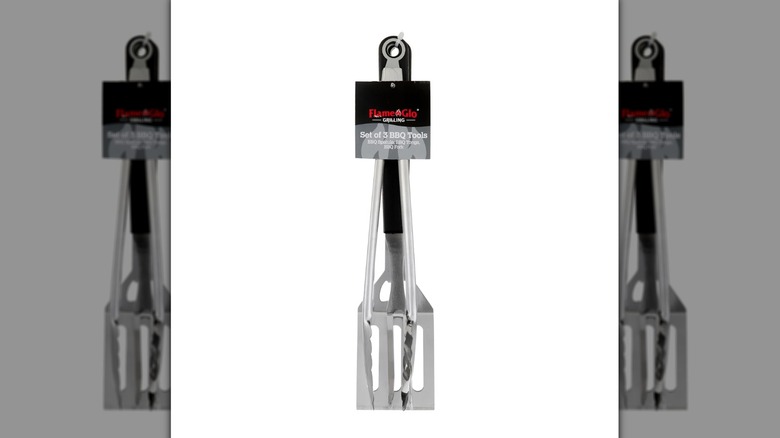 Flame Glo grilling tongs, spatula, and BBQ fork on a white background.
