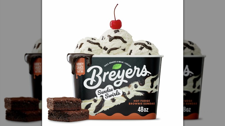 48-ounce container of Breyers hot fudge brownie sundae swirl ice cream on a white background.