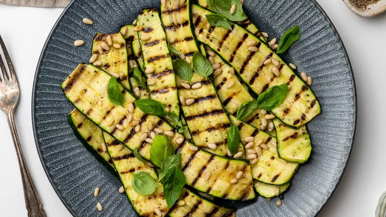 Grilled zucchini planks with basil and pine nuts