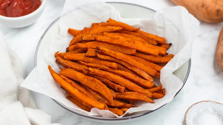 Bowl of sweet potato fries with ketchup