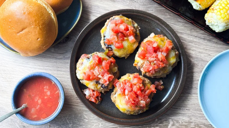 Burgers on a plate with tomato