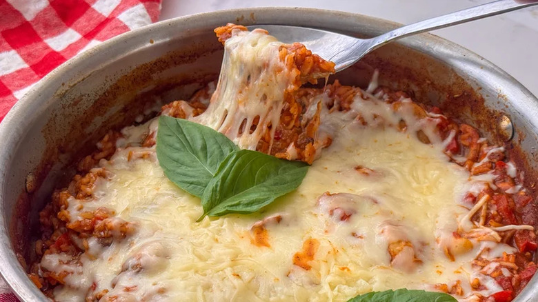 Veggie rice with cheese and a spoon