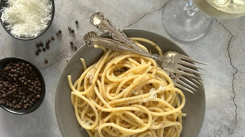Cacio e Pepe in a bowl with cheese and pepper