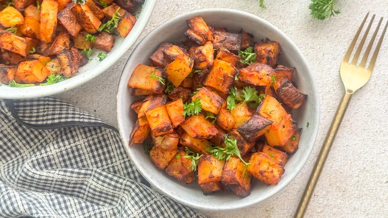 Roasted Spanish Potatoes in a bowl with a fork