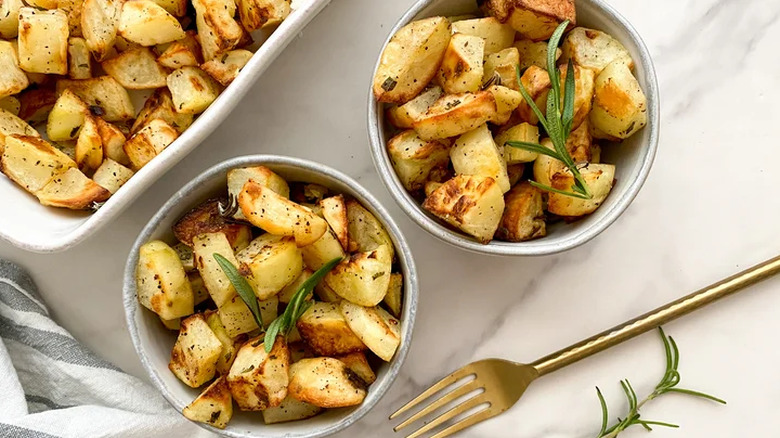 Rosemary potatoes cubed and in bowls