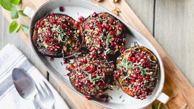 Wild rice-stuffed squash with pomegranate seeds