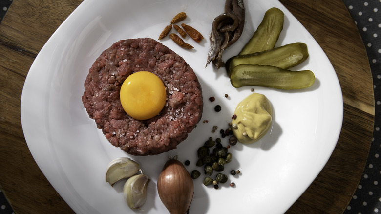Beef tartare with spices and condiments