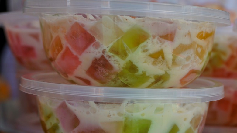Colorful Jell-O salad in plastic container