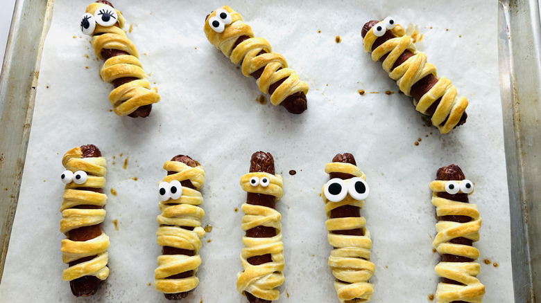 Mummy hot dogs with candy eyes