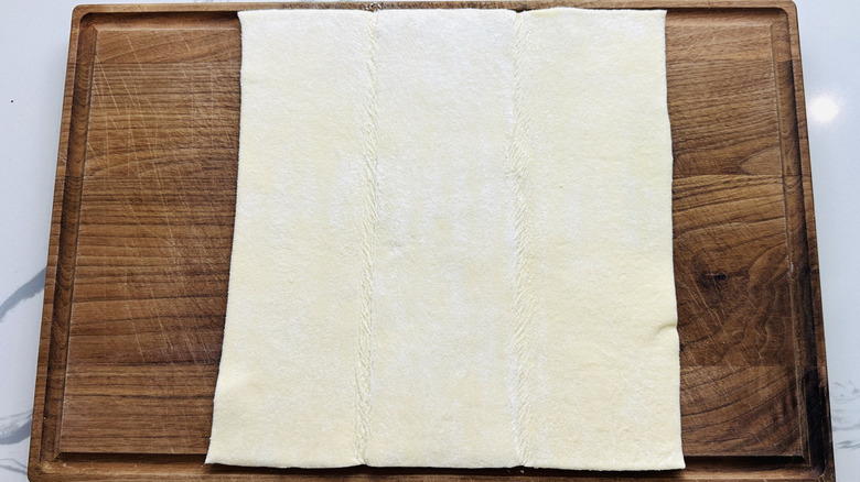 Puff pastry on cutting board