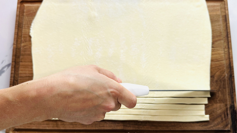 Cutting strips of puff pastry