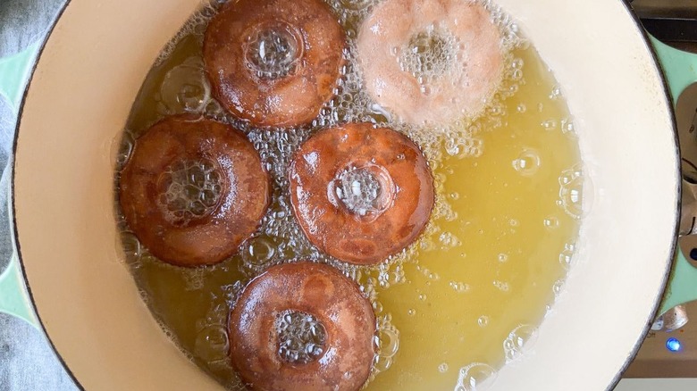 3-ingredient Nutella donuts frying in oil in pot