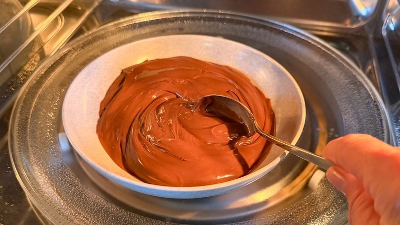Stirring Nutella in bowl in microwave