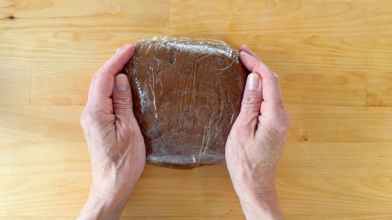 3-ingredient Nutella donuts dough in plastic wrap on countertop