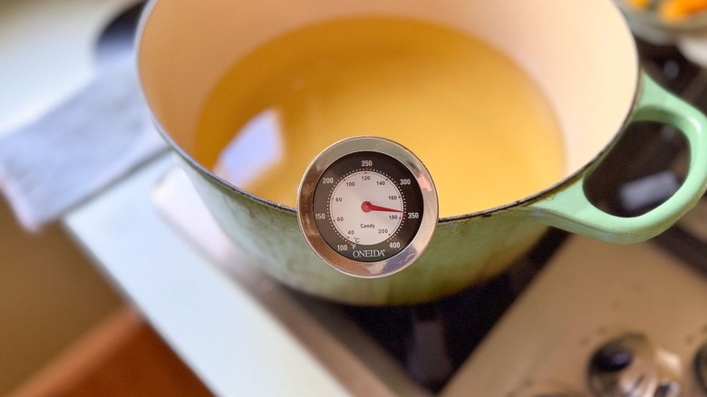 Oil in pot heated to 350 F on thermometer