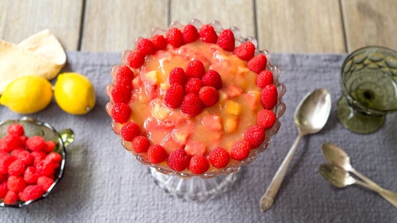 3-ingredient raspberry lemonade British trifle on table with lemons, berries, and spoons