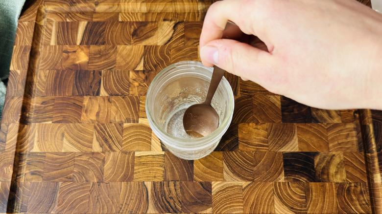 Stirring simple syrup in a jar