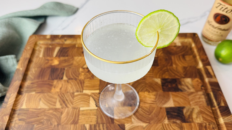 Vodka gimlet in a coupe glass with lime garnish