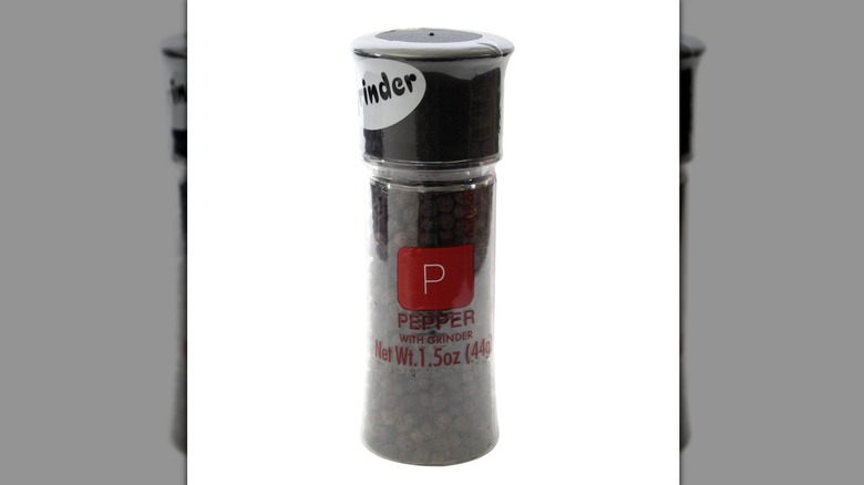 A peppercorn with grinder attachement