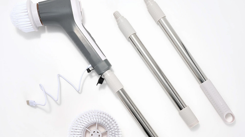 Teko Power Scrubber and attachments on a white background