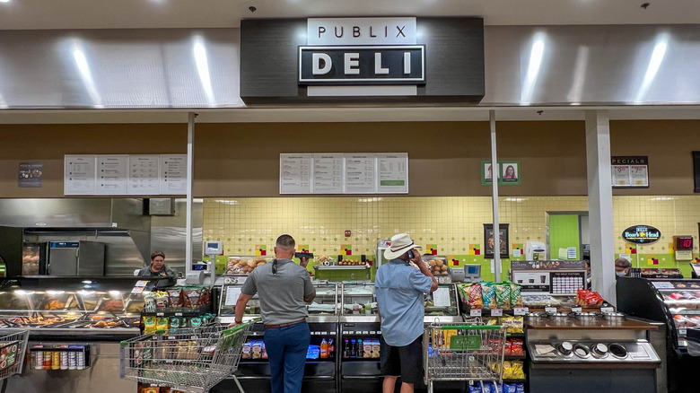 People standing at a Publix deli